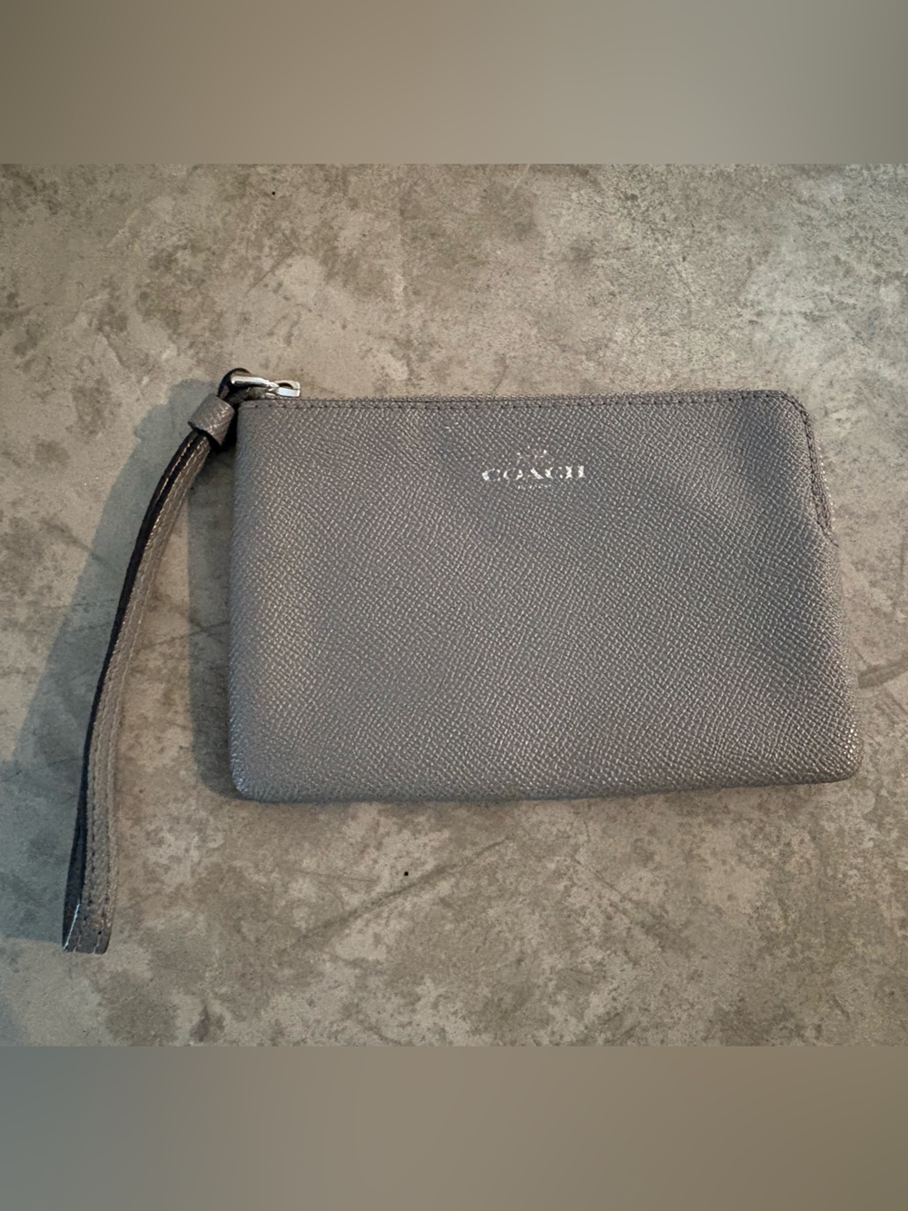 Coach Corner Zip wristlet in a metallic crossgrain leather